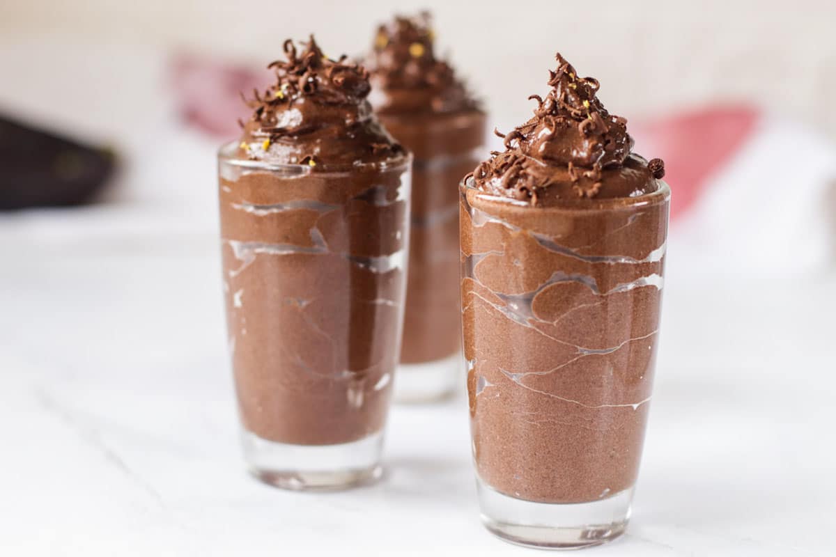 Three glasses of chocolate mousse.